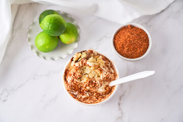Mexican snack, prepared esquite, corn in a cup, with chili