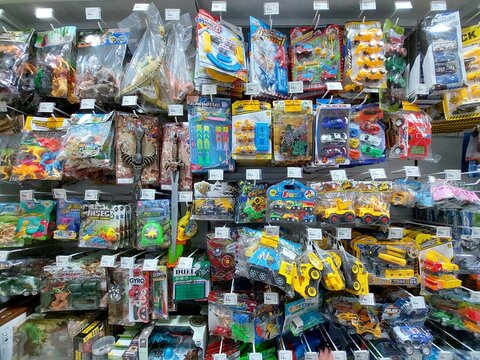 Mr. DIY shop shelf full of toys.