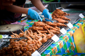 Fried chicken for sale at street food market