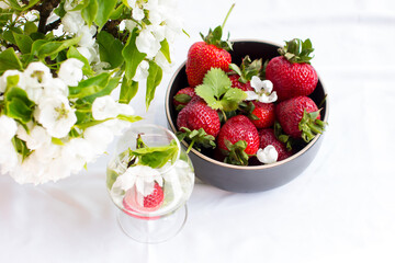 Ripe red strawberries on a plate. Summer harvest