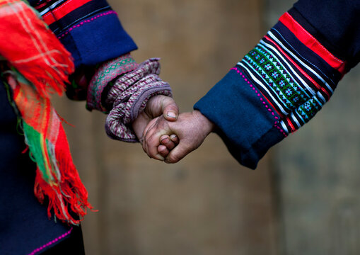 Black hmong kids holding each other s hand, Sapa, Vietnam