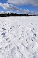 Fototapeta na wymiar The effects of wind on snow, Sainte-Apolline, Québec, Canada