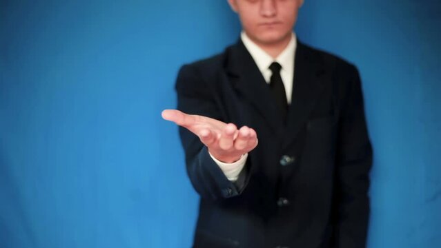 Close-up shot of a hand of a young technologist raising his palm up, a Man using tech. Futuristic tech. 24 FPS HD footage.