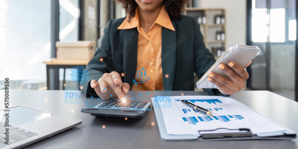 Wall mural Accountant black woman working on laptop and do document, tax, exchange, accounting and Financial advisor concept