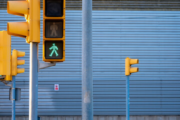 Many traffic signals at a junction in a contemporary modern city
