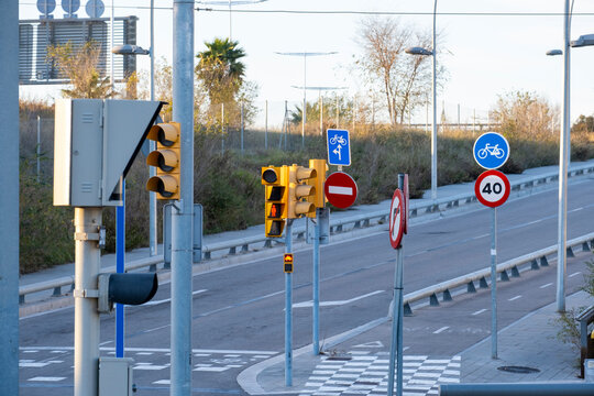 Many traffic signals at a junction in a contemporary modern city