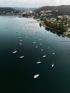 Aerial image of boats moored in Brisbane Water and Gosford in the background