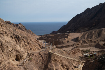 Sinai mountains at daytime, blue sky, top view of the mountains, colorful canyon at sunset in Egypt sunny day, landscape