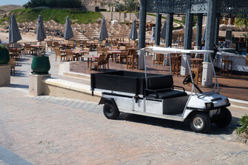 New clean golf course carts cars at luxury resort sport venue in neat line row