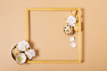 Frame with copy space and Easter eggs composition decorated with twigs and flowers. Easter flat lay monochrome