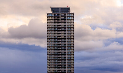 Dramatic weather and tall building after sundown - 575028314