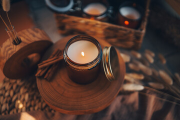 Burning candle in home interior, aesthetics