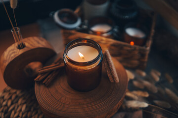 Burning candle in home interior, aesthetics