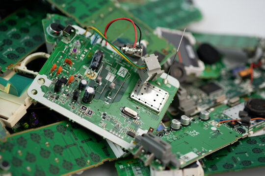 Telephone circuit board parts are being disassembled as electronic waste in the factory. electronic equipment, E-waste is a problem with environmental concepts should be reused