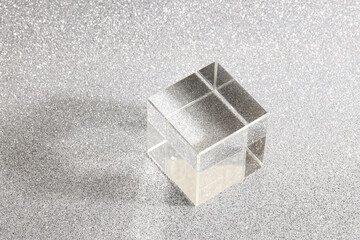 transparent podium for product display on silver glittering background. pedestal, stage for...