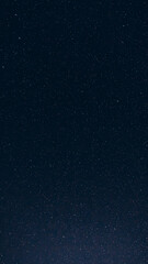 Natural Night Starry Sky. Amazing Glowing Stars And Meteoric Tracks Trail In Dark Night Starry Sky Background. Glowing Stars And Meteorite Trails.