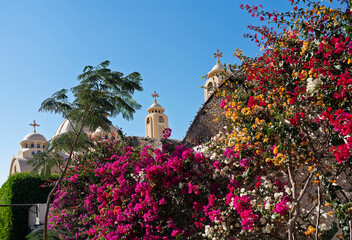 Coptic church - The Heavenly Cathedral with bougainvillea flowers in Sharm El-Sheikh, Egypt