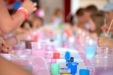 Collective children's creativity painting with paints.