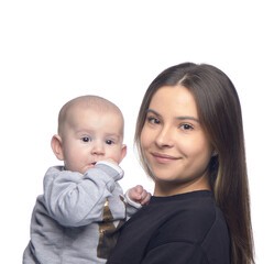 Young girl with a baby in her arms, joy with a newborn laughing