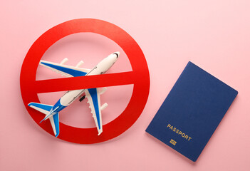 Flight ban. Passenger plane with passport and prohibition sign on pink background