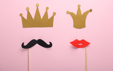 Mustache and lips on a stick with crown on a pink background. King and queen of the party