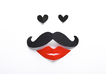 Creative minimal portrait with hearts, mustache and lips on a white background. Paper art