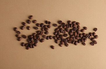 Coffee beans on brown background