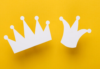 Two paper white crowns on yellow background