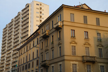 Fototapeta na wymiar Old and modern buildings along via Ferrucci in Milan