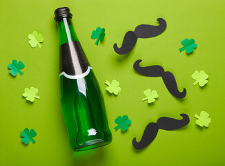 Happy St. Patrick's Day. Irish green beer bottle, mustache and leprechaun hat on green background....