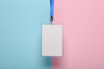 Empty white ID card badge mockup with blue belt on pink blue background. Staff identity name tag....