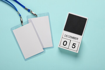 World Volunteer Day. Id card badges and calendar with date December 05 on a blue background