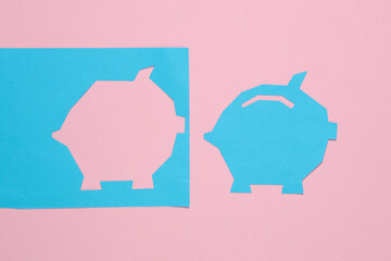Paper-cut piggy bank on a pink background