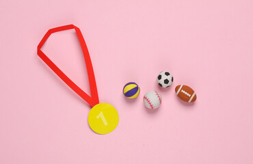 Paper-cut gold medal with balls on pink background. First place. Competition, prize, trophies,...