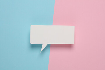 Fototapeta na wymiar White blank paper-cut speech bubble on pink blue background. Chat, social media, discussion. Mock up for template design