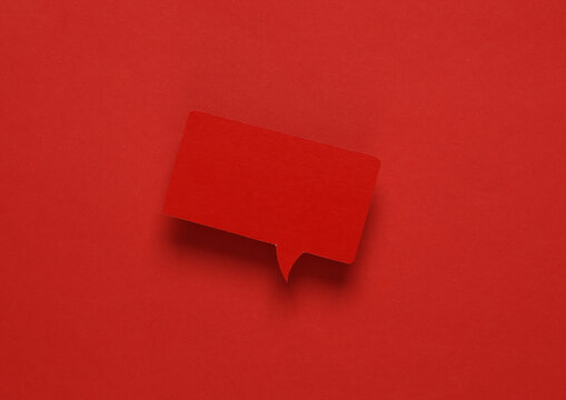 Red blank paper-cut speech bubble on red background. Chat, social media, discussion. Mock up for template design