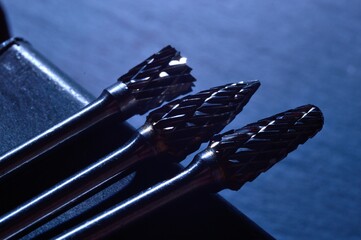 cutters of tungsten carbide on the background of metal blanks. Close-up.