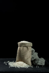 A bag of rice on a black background. Traditional food
