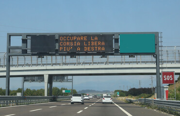 Road sign with text that means stay in the right lane in Italian language