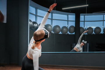 Sports fit Young athletic woman in virtual reality fitness,pilates,relaxation,mental health.Active...