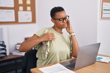 African american woman business worker stressed using laptop at office