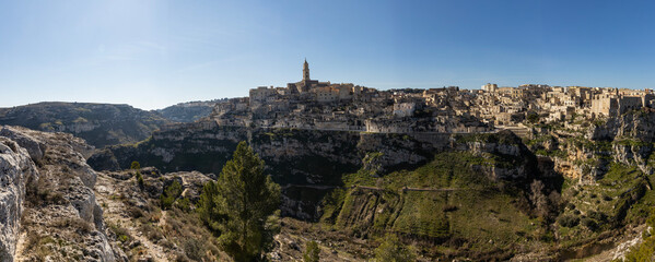 Panorama of Matera, a UNESCO World Heritage Site. European Capital of Culture. View from the Murgia Park. Timeless walk inside Paleolithic caves. City similar to Jerusalem. Unforgettable journey