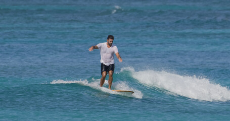 Man surfer surfing ocean waves