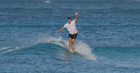Man surfer surfing ocean waves