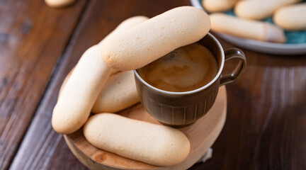 Cookies cat's tongue. Traditional Indonesian and Italian biscuit pastries. Dessert and espresso coffee