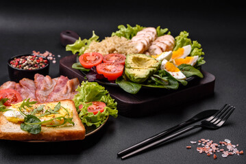 Delicious healthy lunch consisting of chicken, avocado, quinoa, eggs and tomatoes