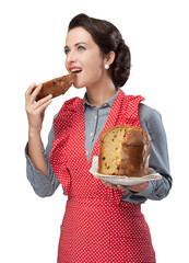 Woman in apron eating panettone