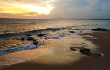 Aerial view of the sunset on the beach on the ocean. Beautiful background for tourism and advertising. Tropical coast