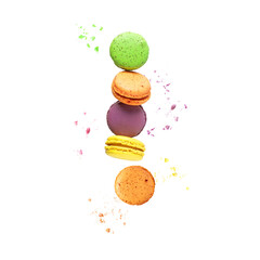Sweet colorful macaroons macarons and crumbs flying isolated on white background.