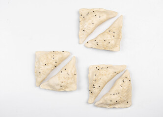 Frozen fresh samsa with black sesame on white background